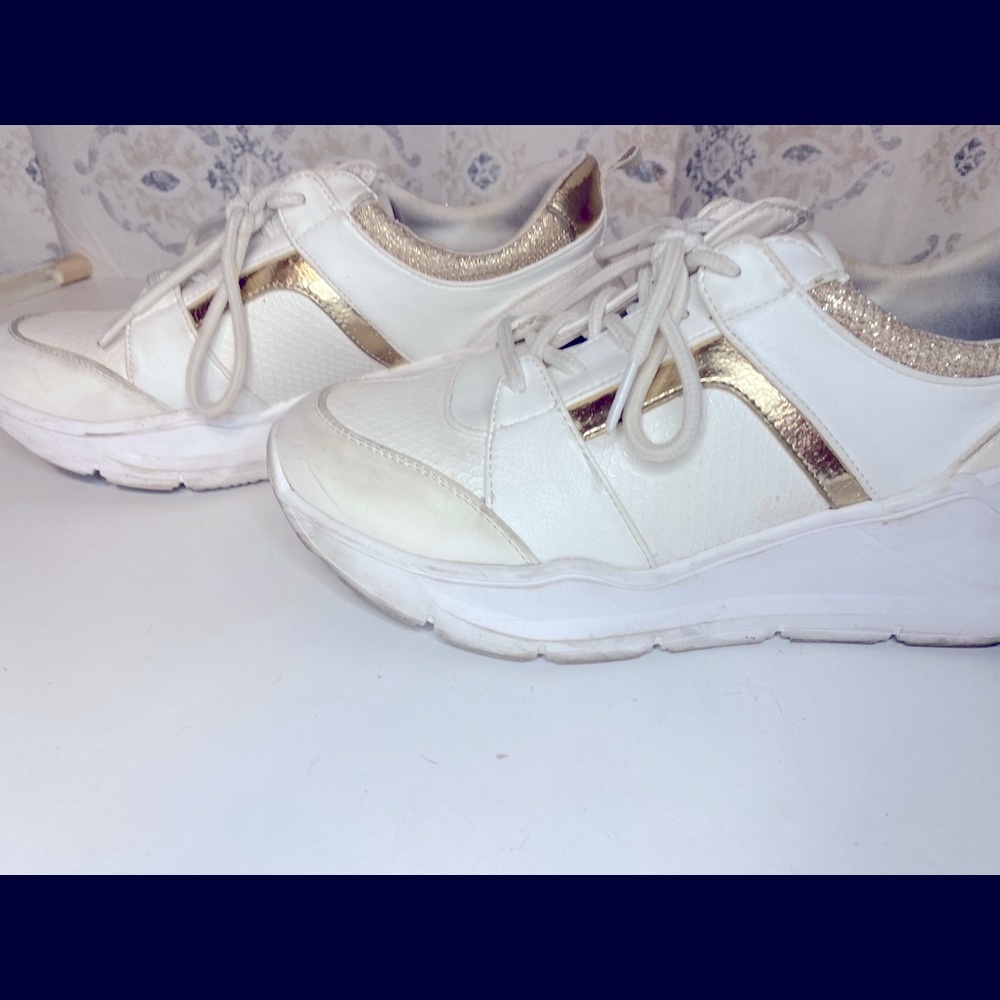 White and gold sneakers